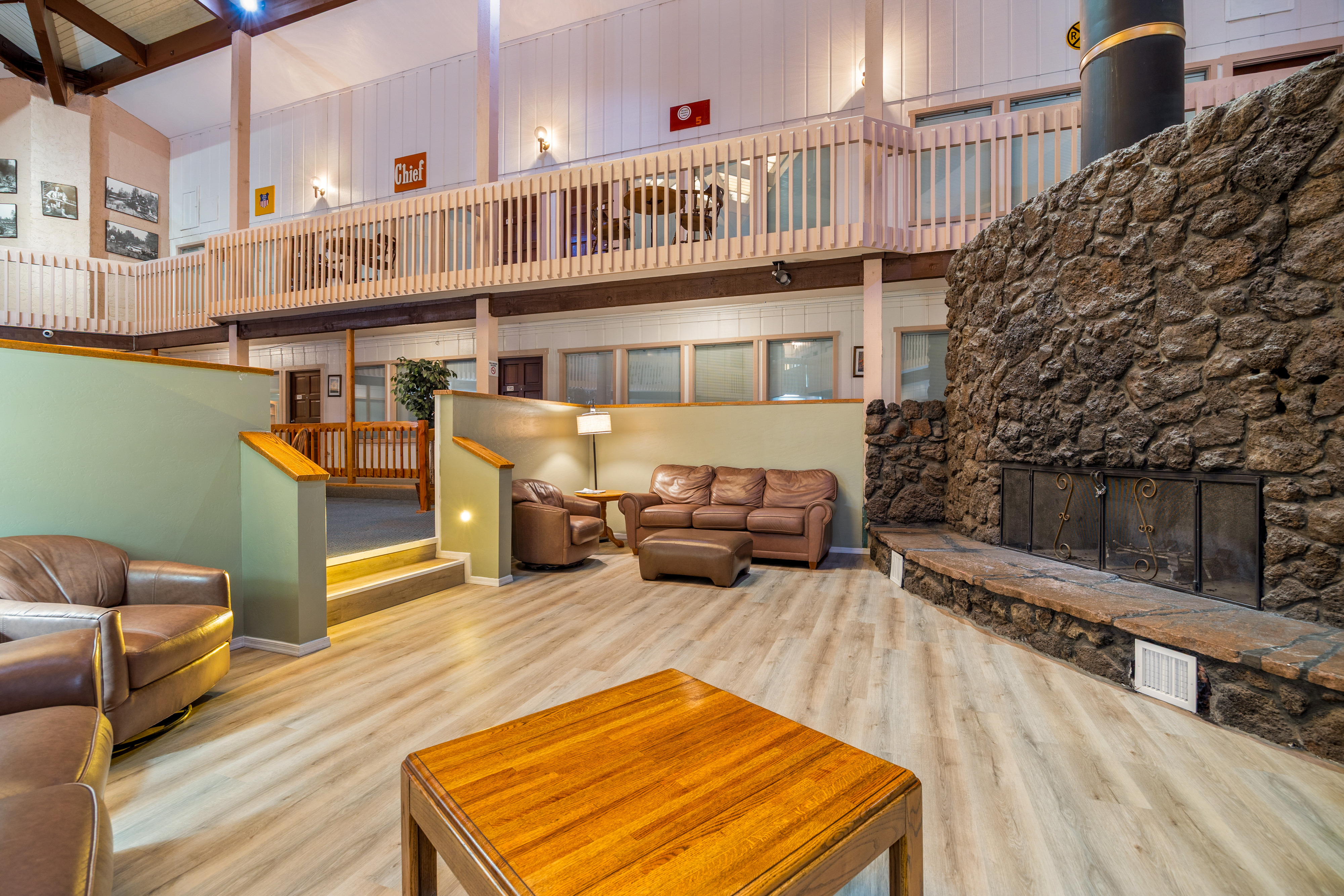 Lodge lobby with stone fireplace and leather couches